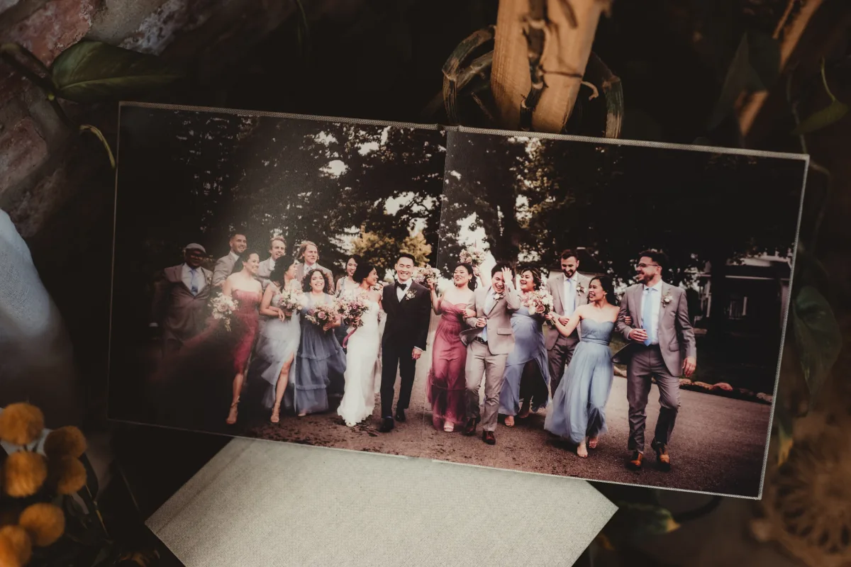 An open wedding album with Twig & Olive photographs