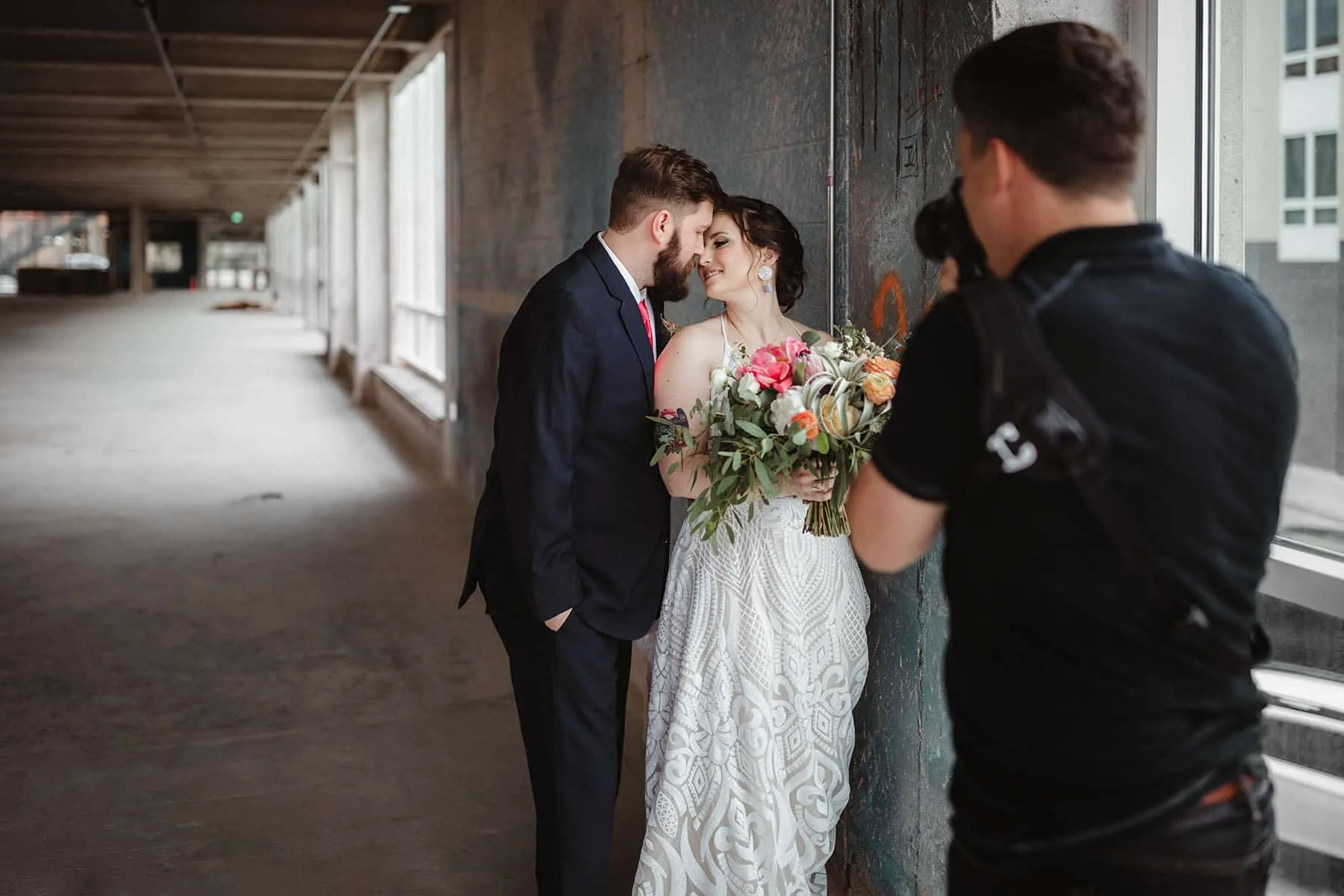 Doug photographing a wedding couple