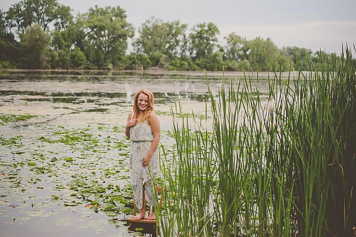 Senior Girl Standing in Pond