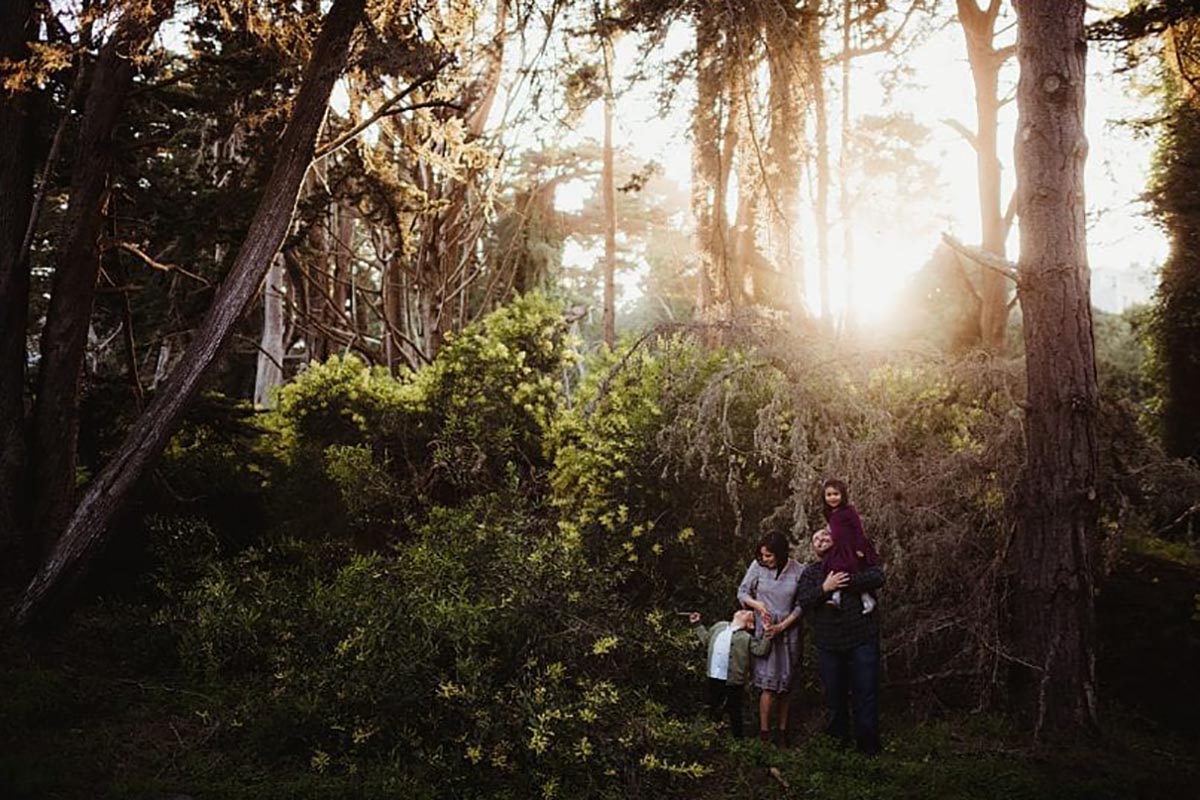 Family in Forest Sunset