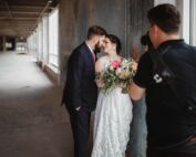 Photographer capturing a couple during a hands-on session of the Photography Business Online Workshop, showcasing real-world client interaction and skills.