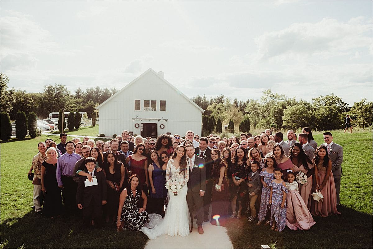 Rustic Barn Wedding Bride and Groom and All Guests Outside