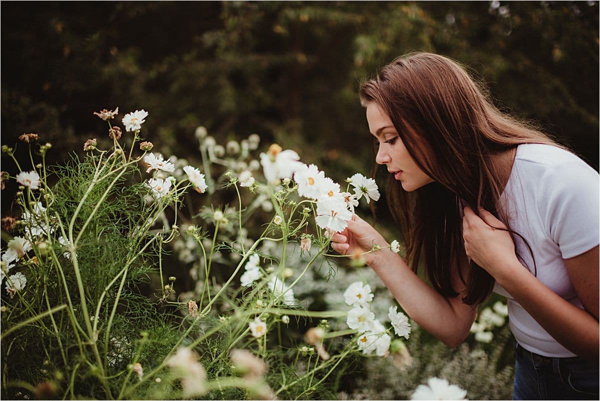 Girl Smelling White Flowers