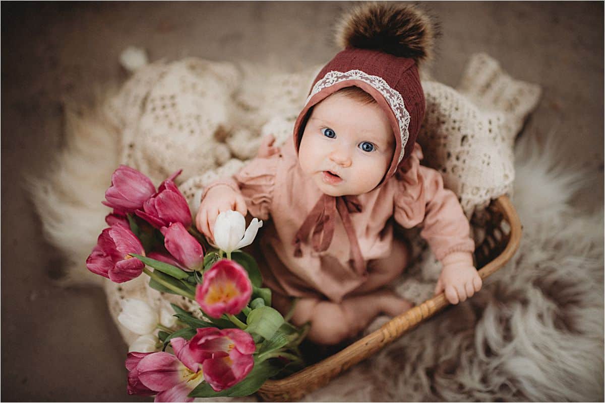 Baby Girl in Hat With Flowers