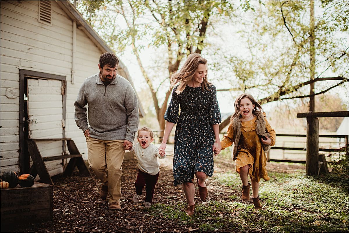 Outdoor Family Farm Session Family Holding Hands