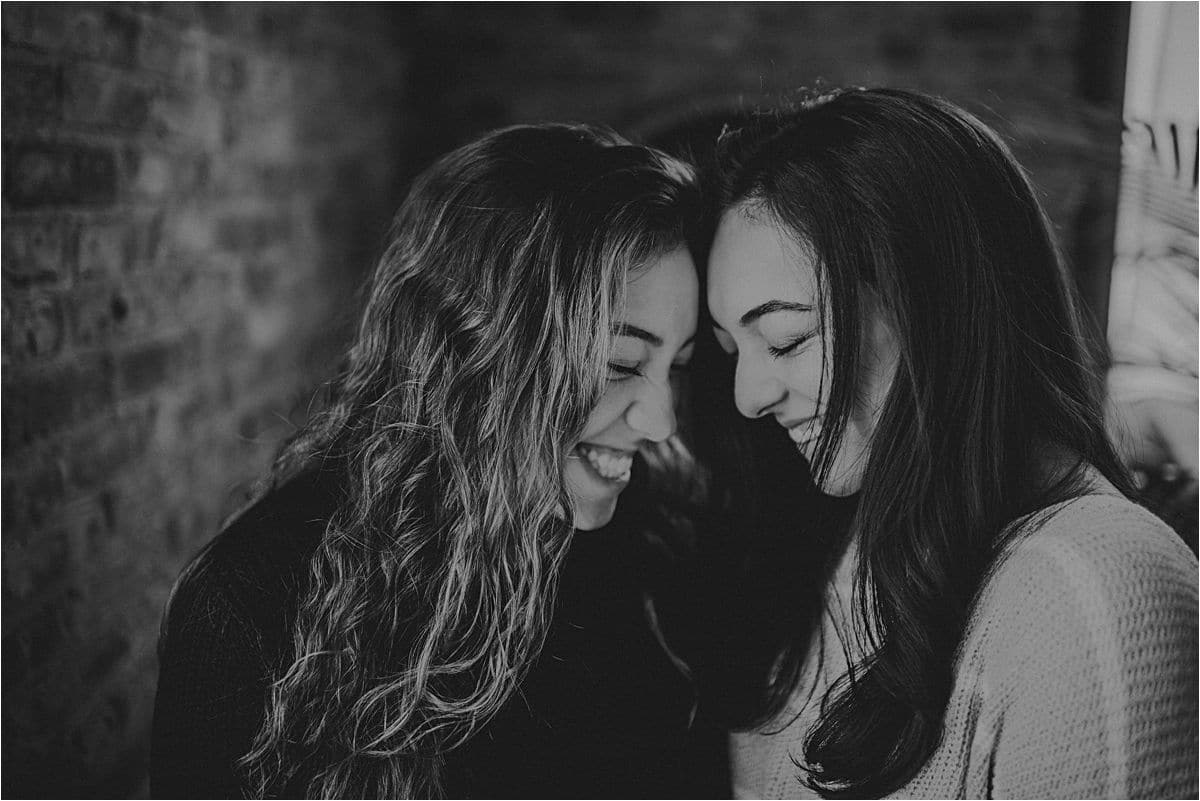 Black and White Portrait Sisters Touching Foreheads