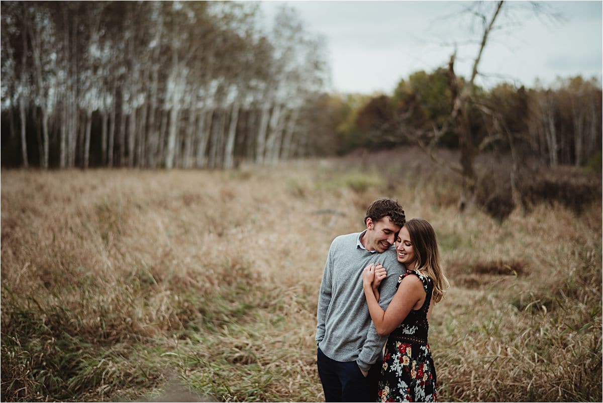 Autumn Leaves Engagement Session Couple in Field