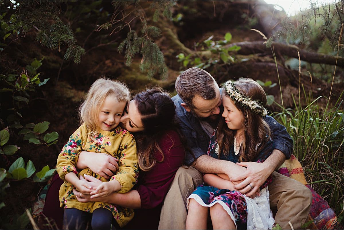 Family Snuggling in Woods