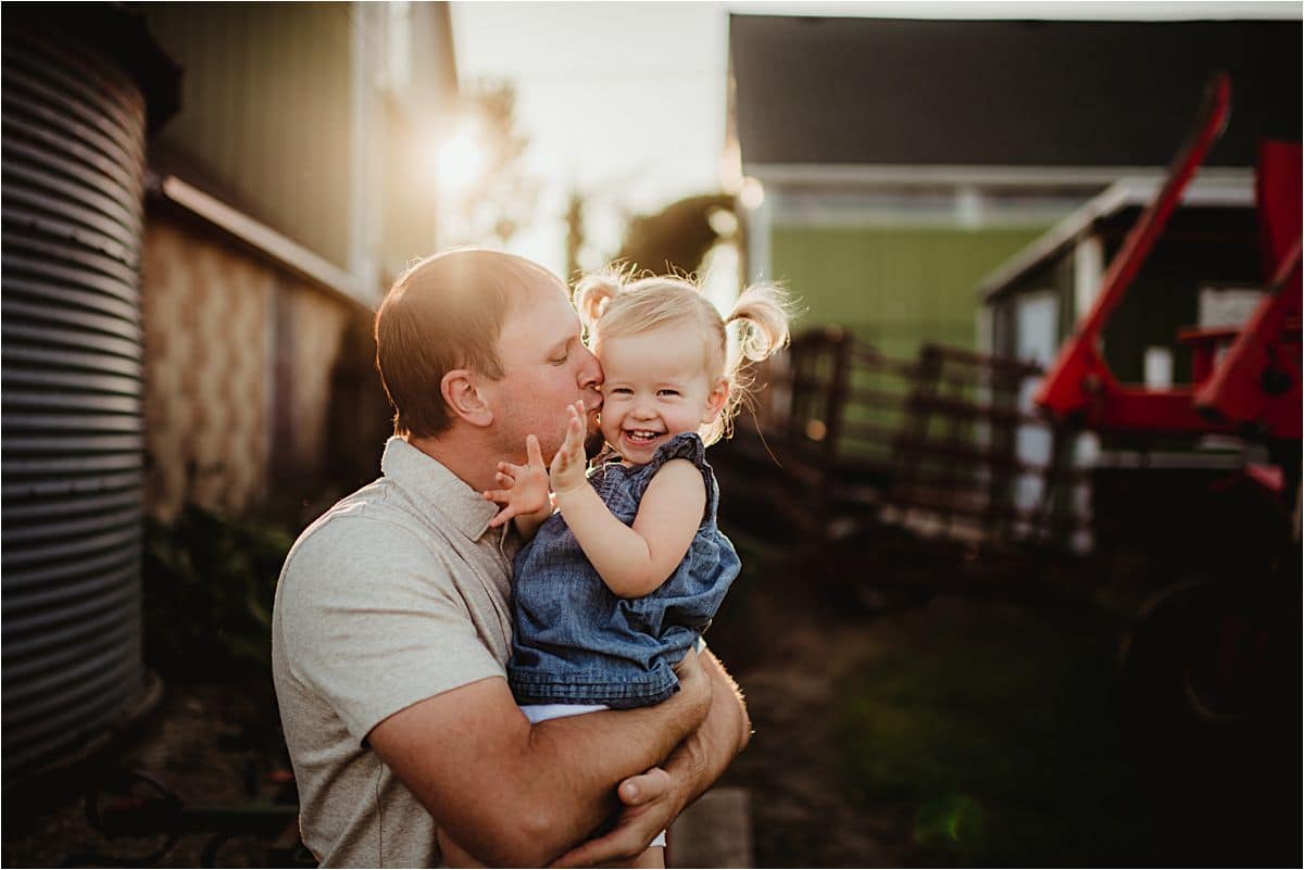 Sunset Sunflower Session Dad Kissing Daughter