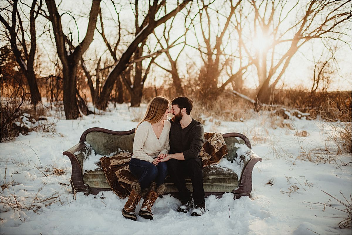Snowy Sunset Engagement Session Couple on Couch