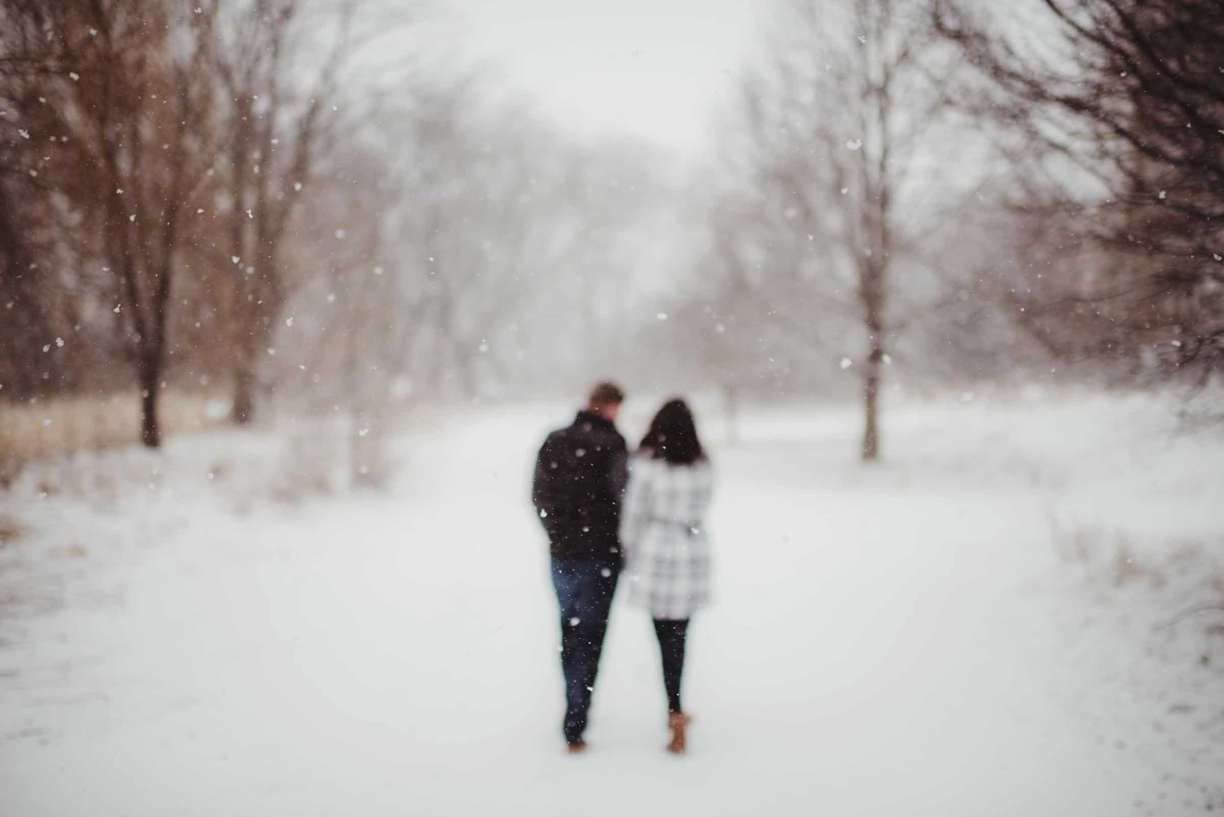 Couple Walking Away in Snow