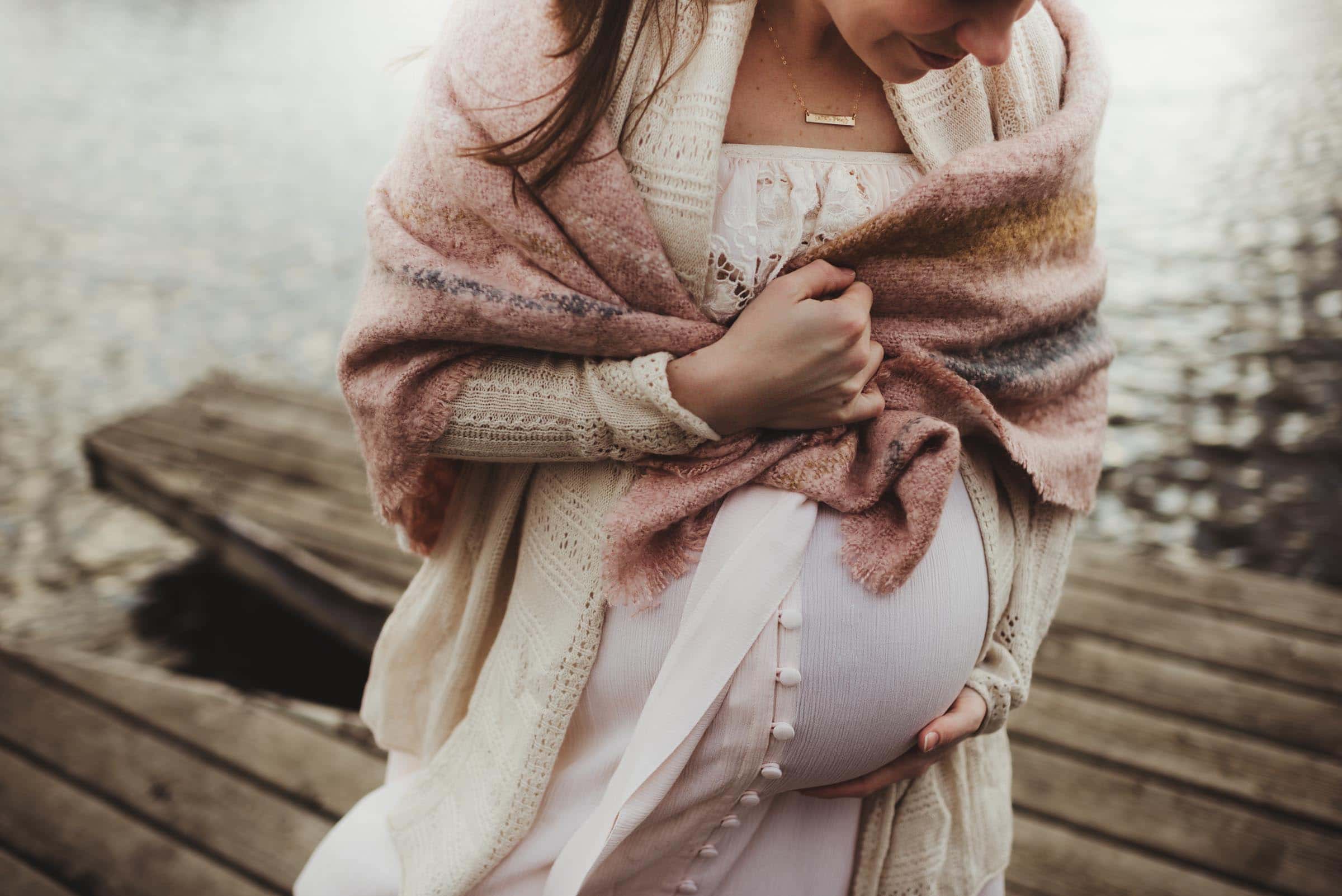 Close Up Baby Belly Woman Wrapped in Sweater