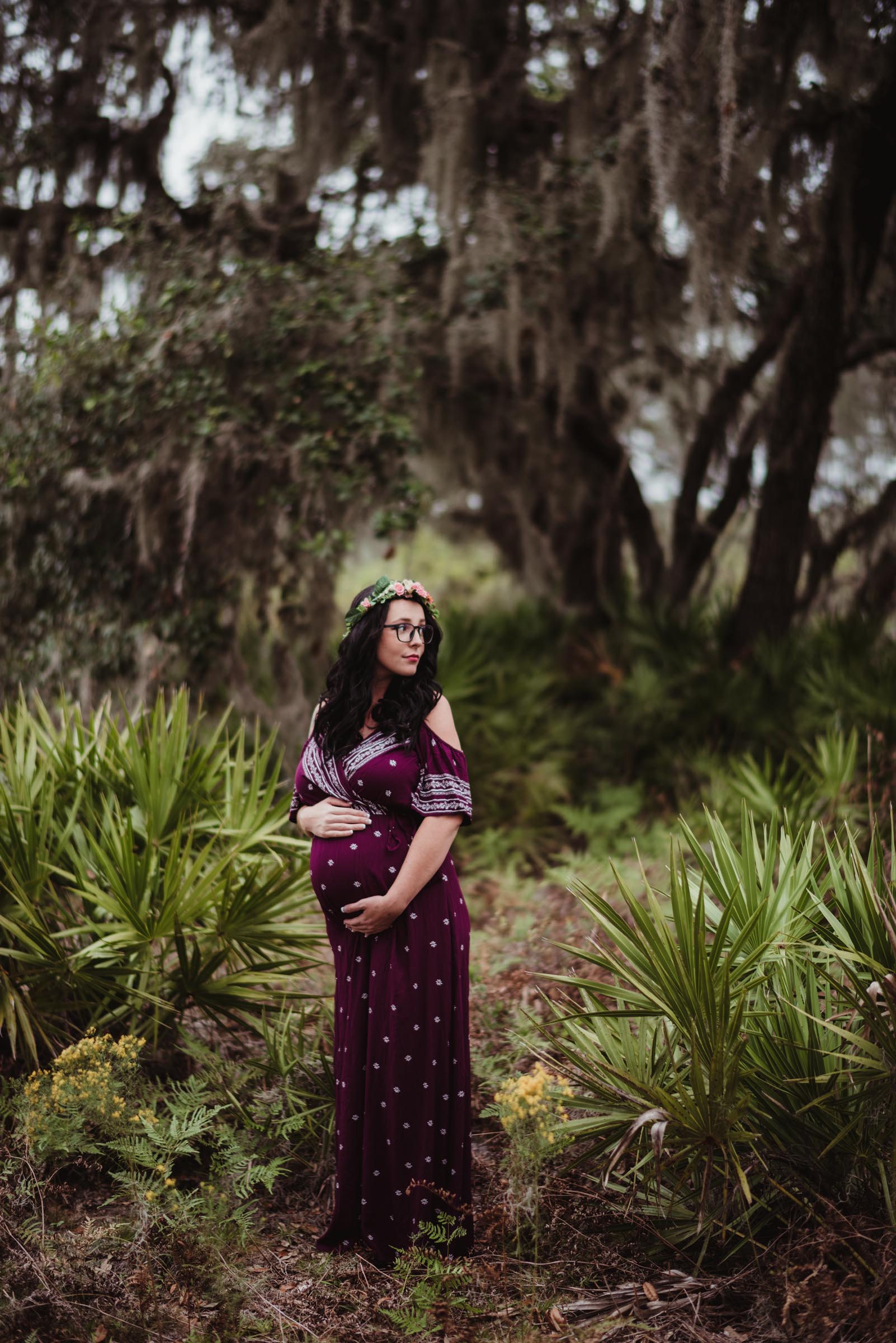 Pregnant Woman Holding Baby Bump in Trees
