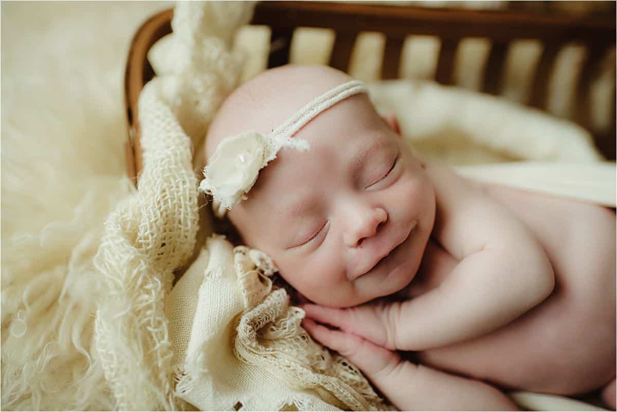 Newborn Girl Smiling in Sleep