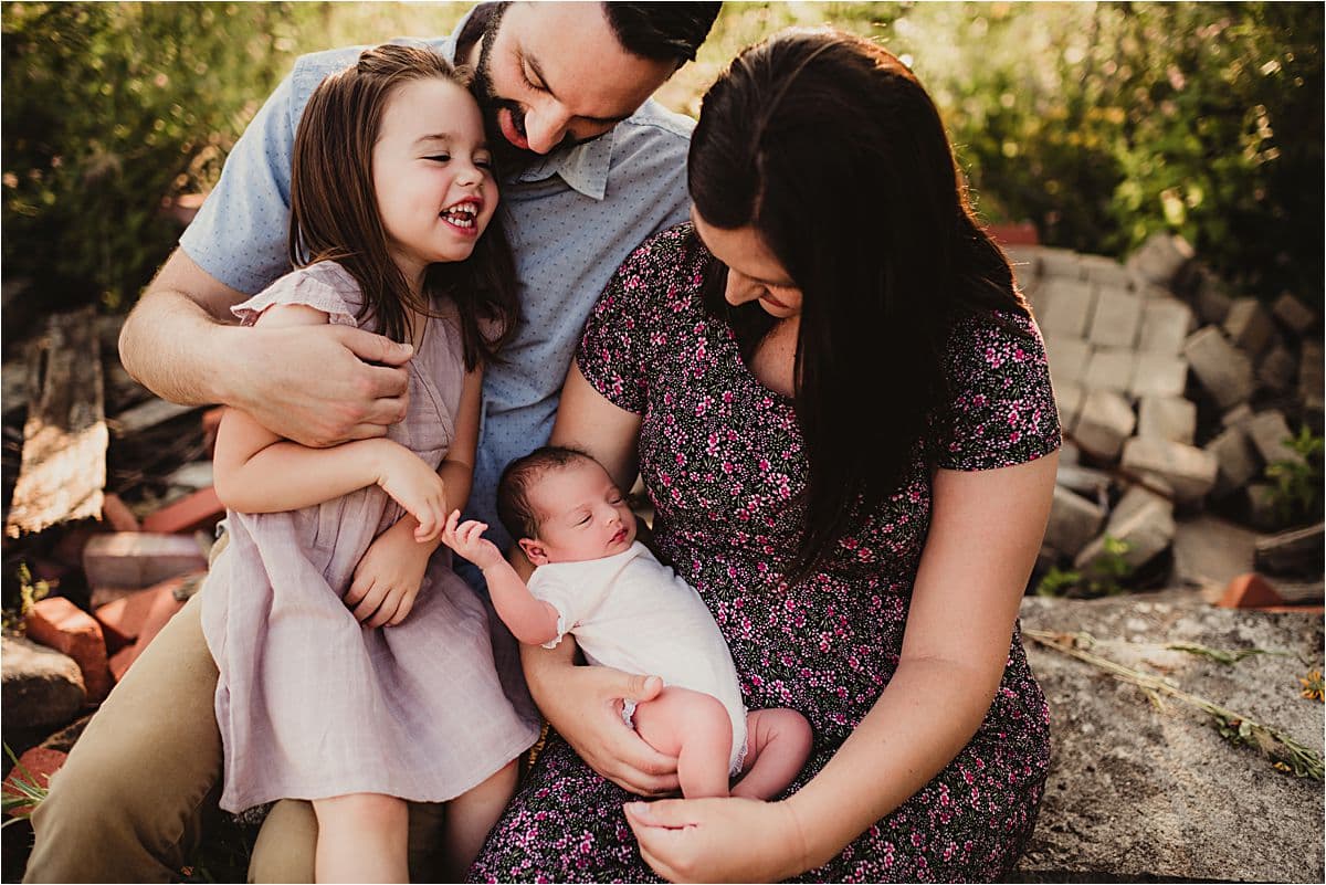 Urban Wildflower Newborn Session Family Snuggling