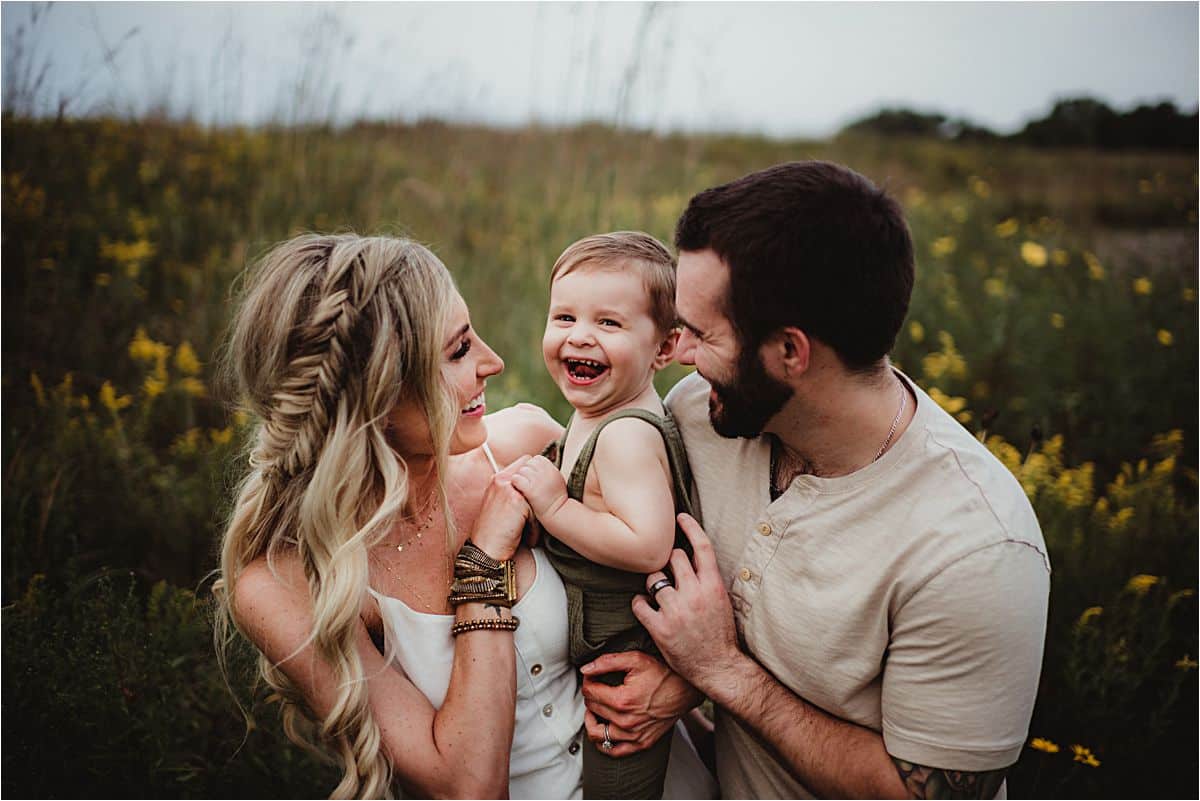 Boho Summer Family Session Parents Hugging Laughing Son