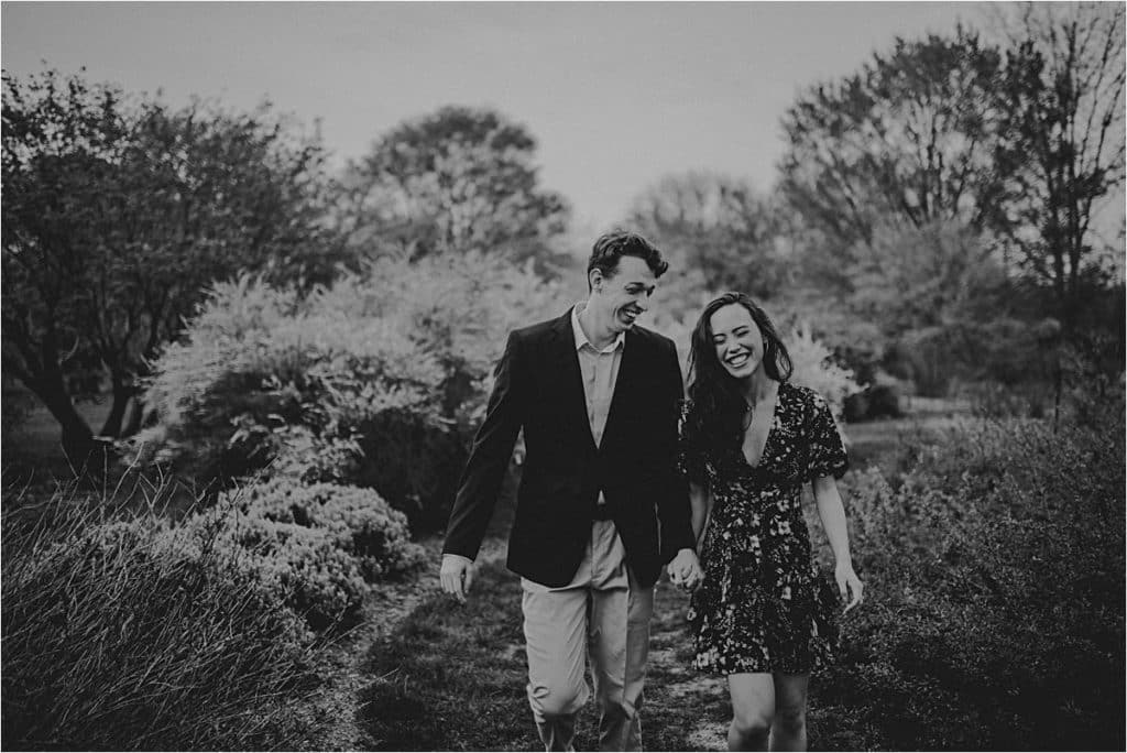 Magnolia Blooms Engagement Session Couple Walking Smiling