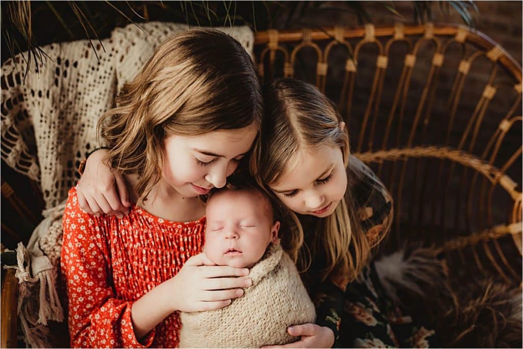 Sisters with Newborn Brother