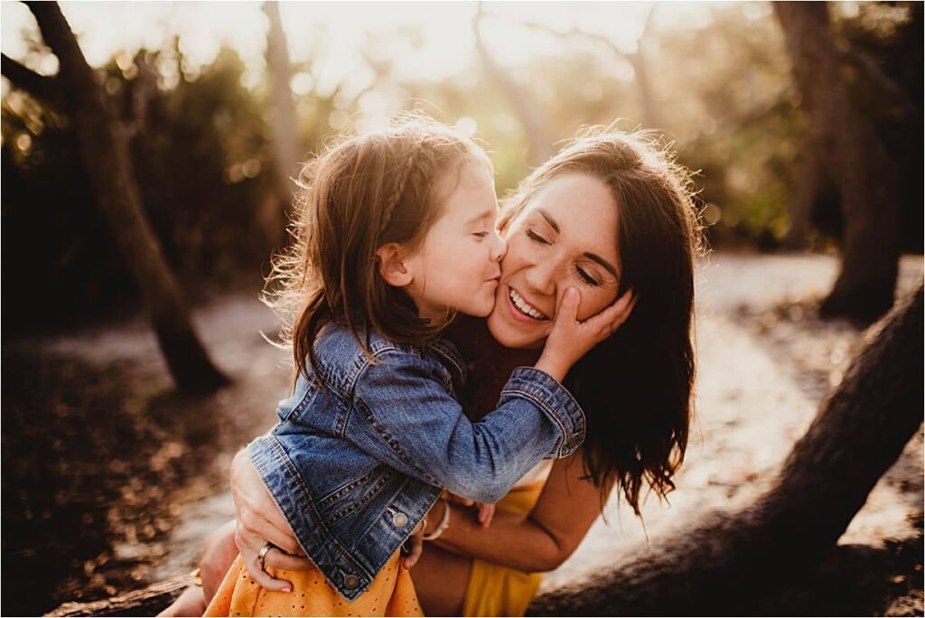 Girl Kissing Mom's Cheek