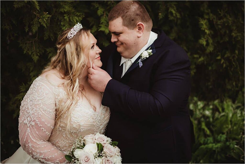 Groom Touching Bride's Face