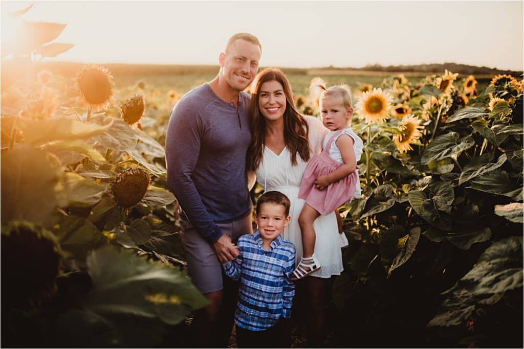 Family in Sunflower Field
