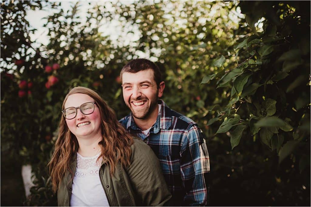 Apple Orchard Engagement Session Couple Laughing
