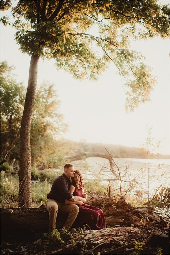 Fall Engagement Session Couple Sitting on Log