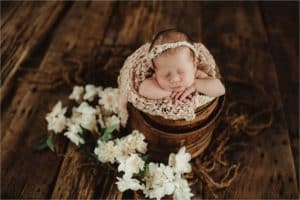 Newborn Girl with Flowers