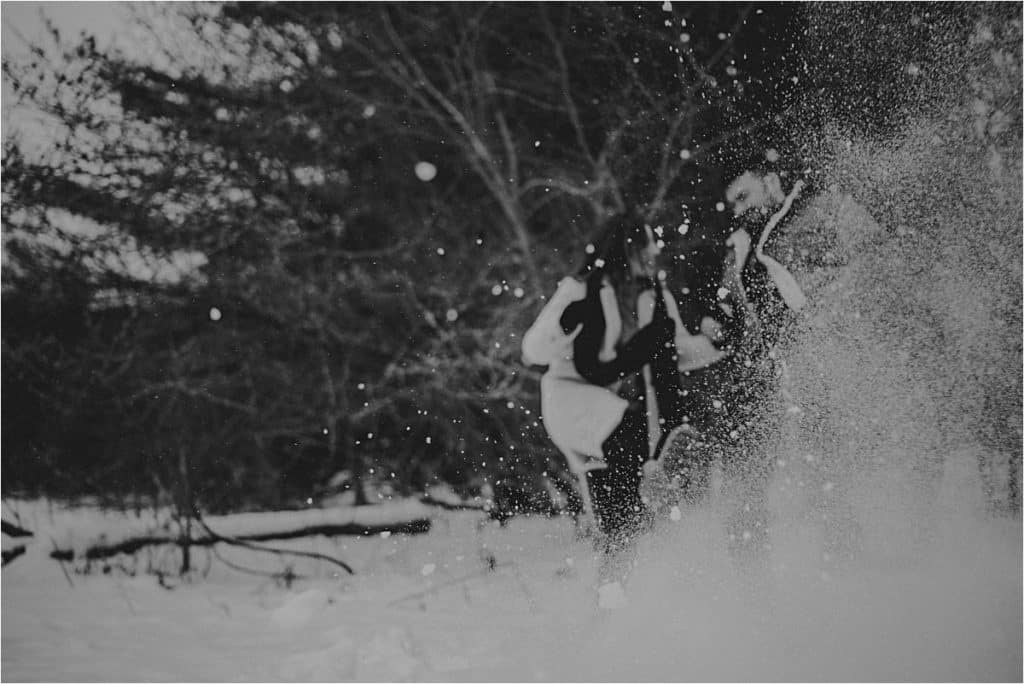 Couple Kicking Snow