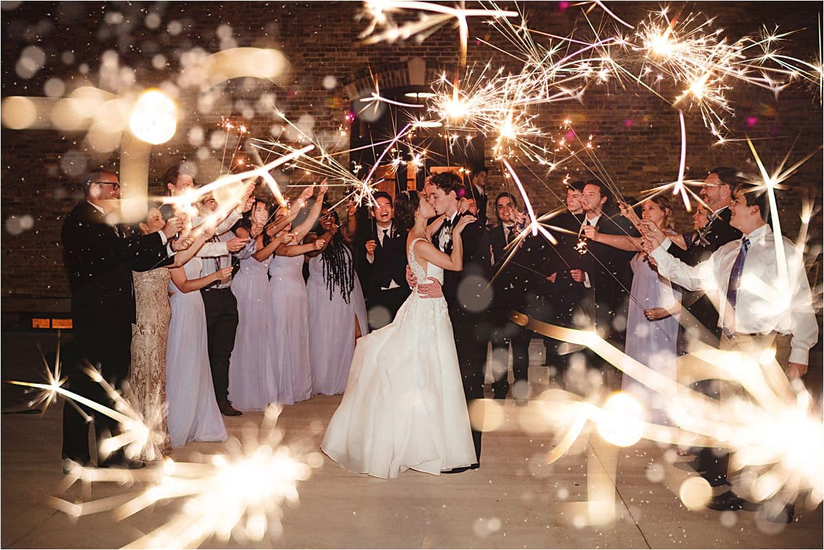 Wed Couple Kissing Sparklers