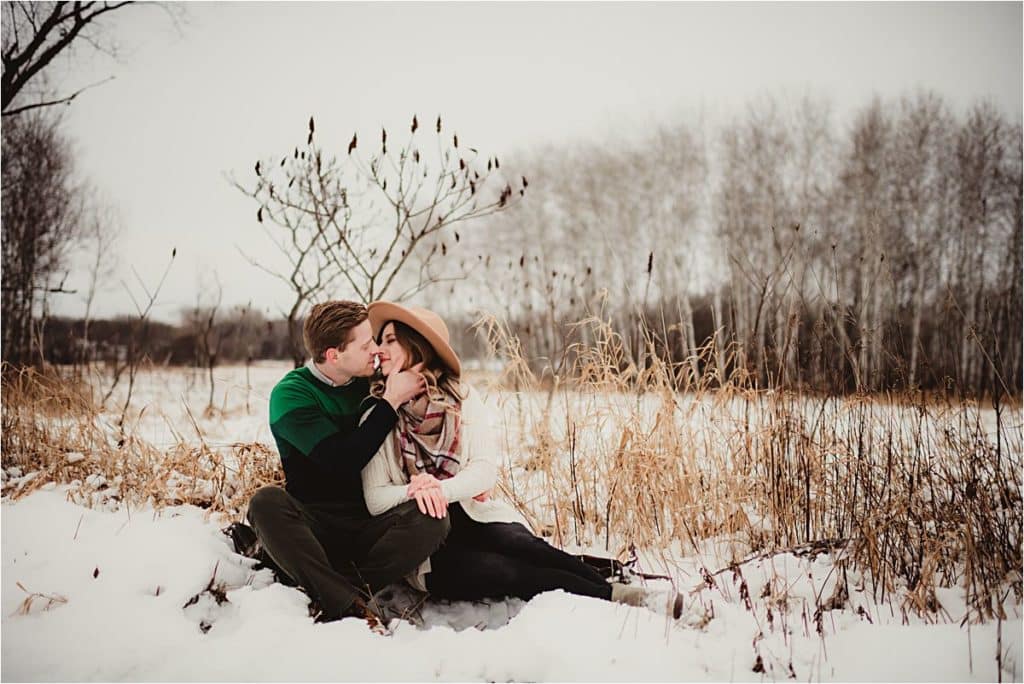 Snowy Winter Engagement Session Couple Touching Foreheads