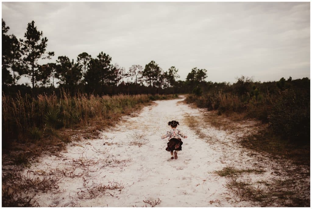 Little Girl Running on Path
