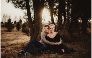 Couple Snuggling by Tree