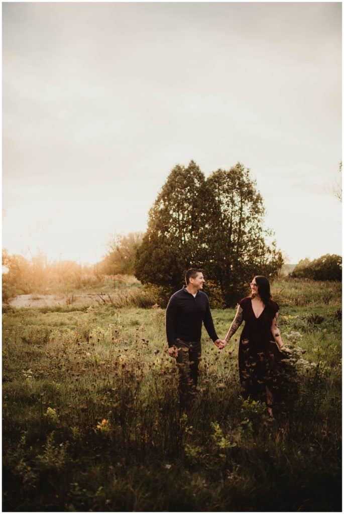 October Sunset Engagement Session Couple Holding Hands