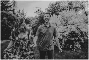 Playful Spring Engagement Session Black White Image Couple Laughing