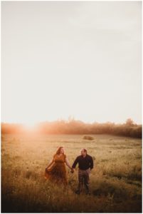 Romantic Sunset Engagement Session Couple in Field at Sunset