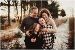 Snowy Sunset Family Session Family Snuggling 