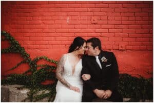 Couple by Red Brick Wall