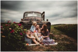 Family Snuggling by Truck