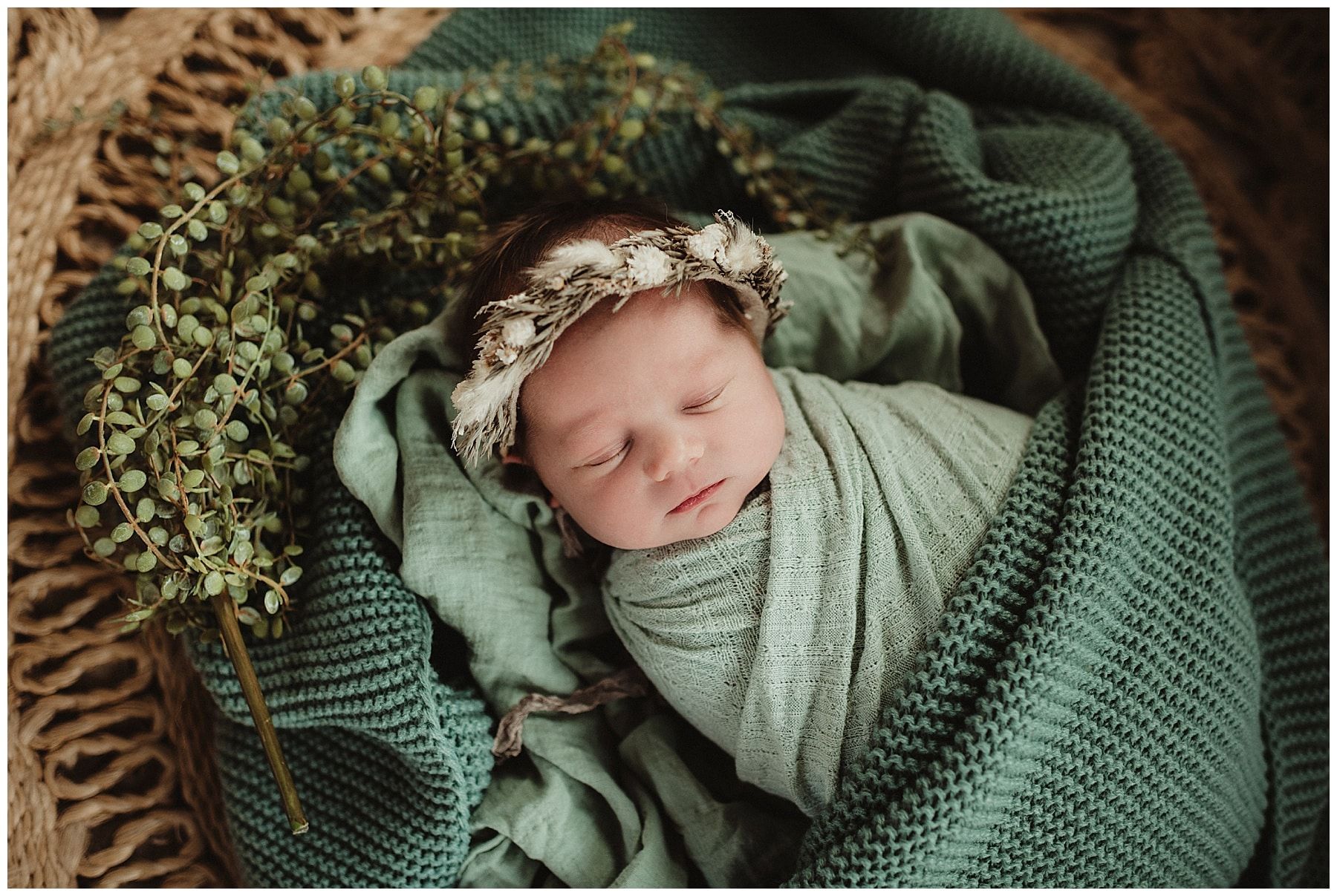 Newborn Girl in Green Wrap