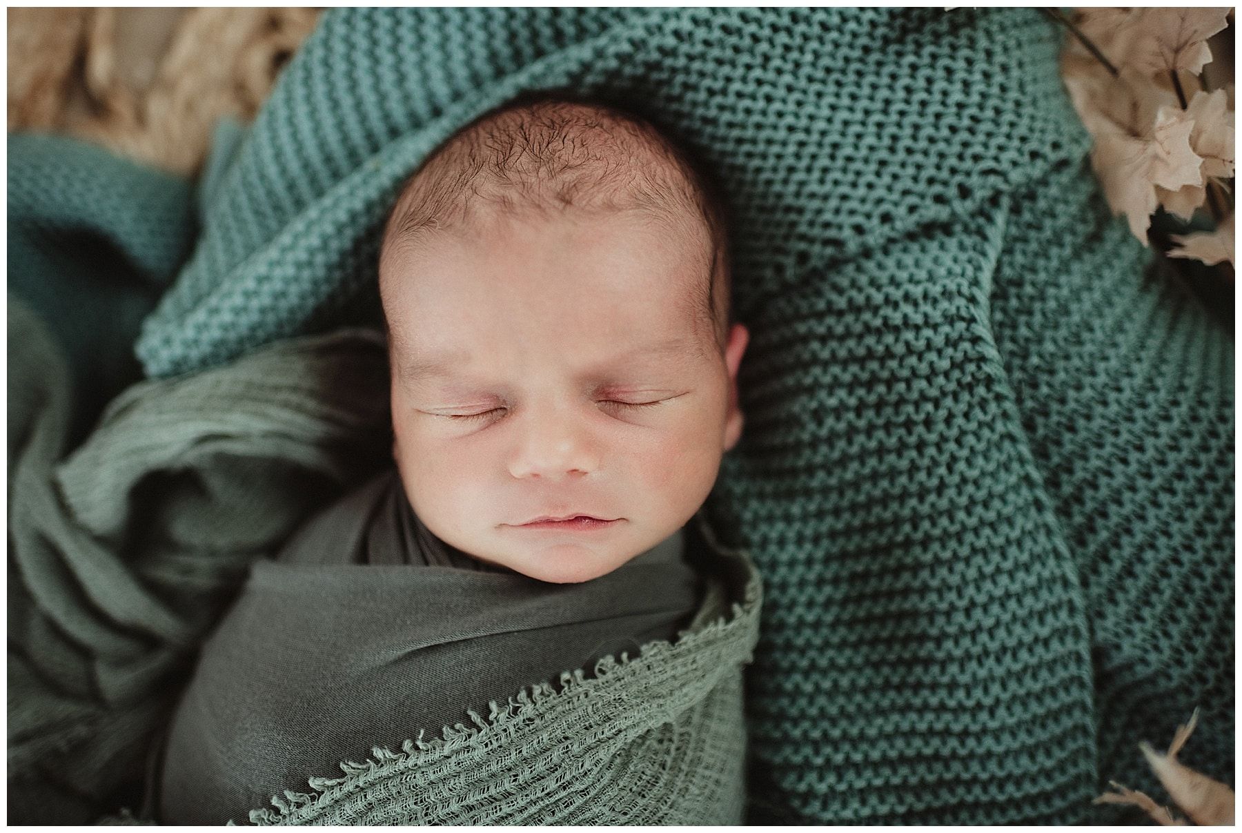 Newborn Boy in Green Wrap