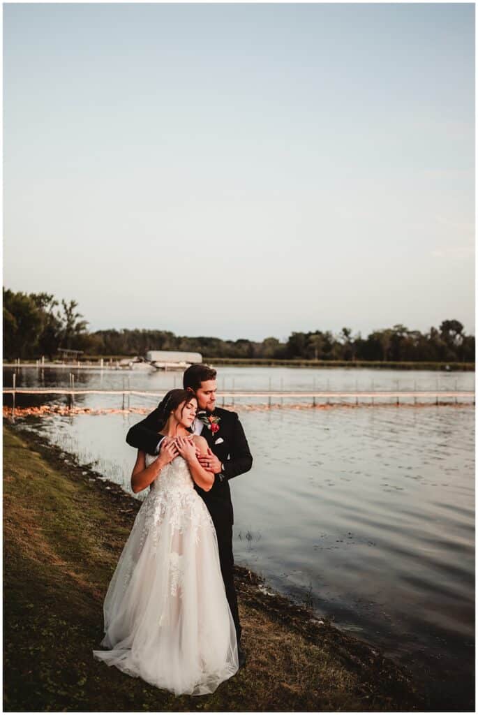 Milwaukee Area Wedding Photography Bride Groom Snuggling by Water