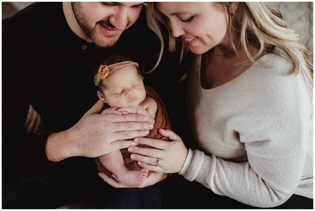Madison Baby Photography Parents Snuggling Newborn 