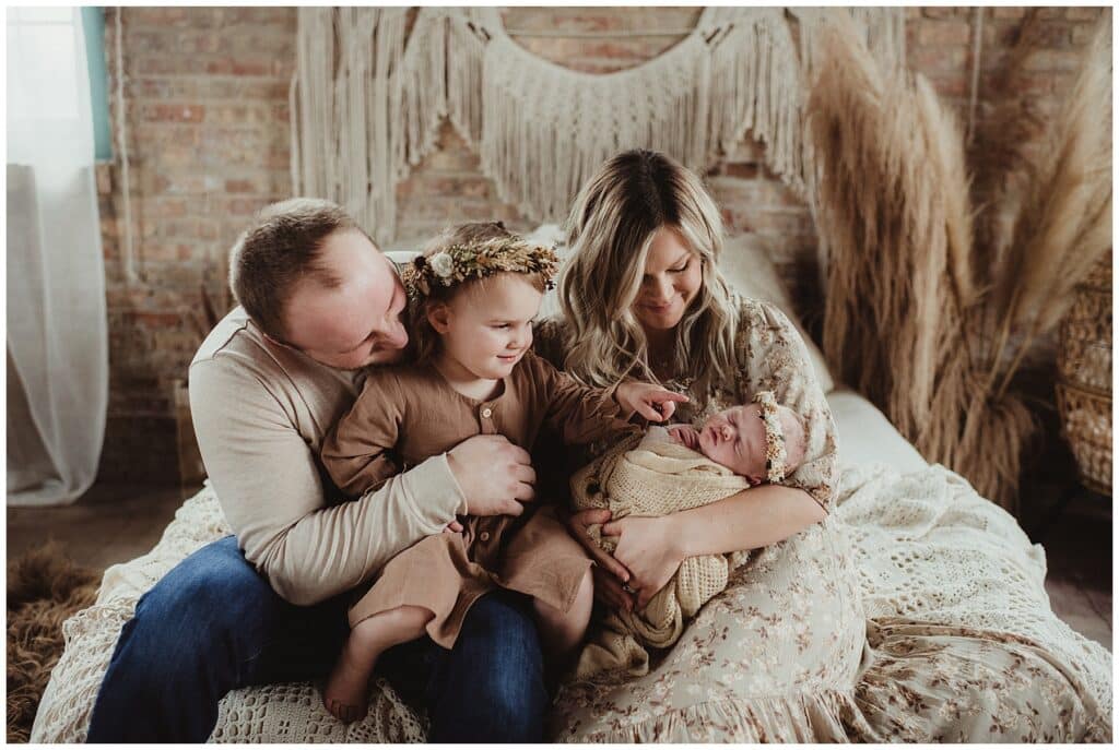Wisconsin Baby Photography Family Snuggling Newborn