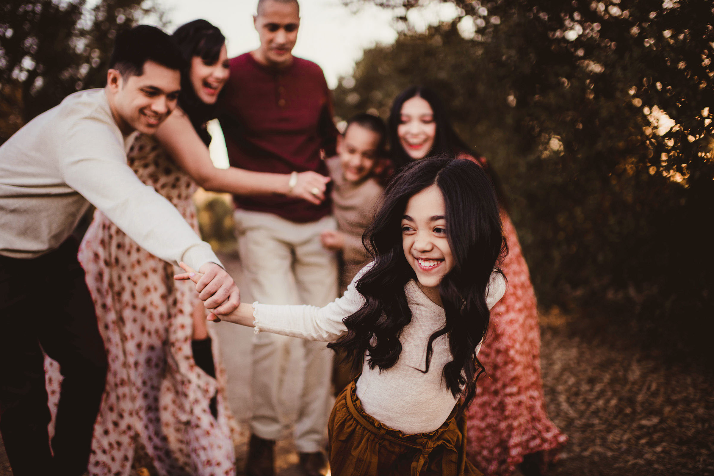 Young girl grinning during a family portrait session in Madison Wisconsin