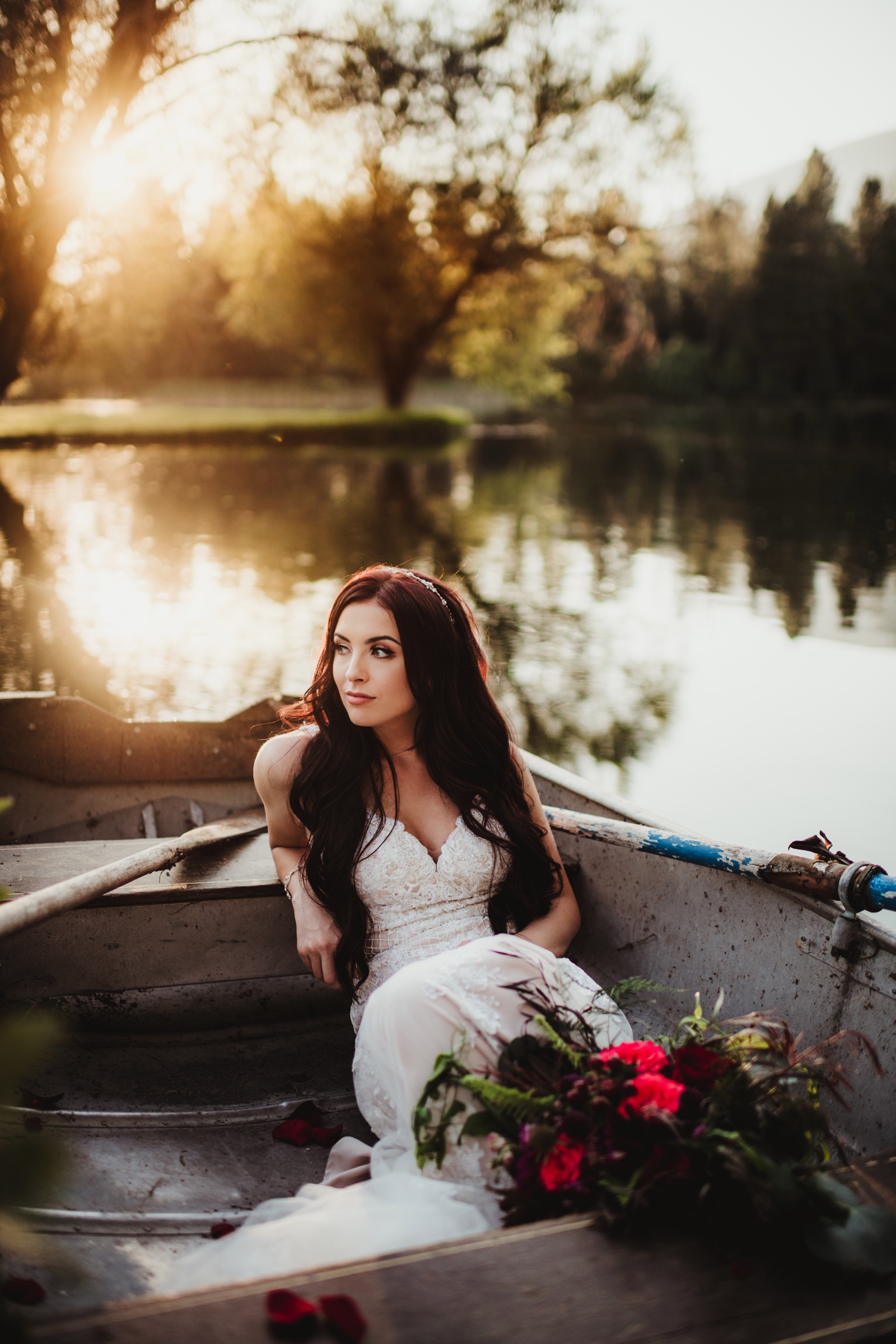 Bride in white dress with flowers at sunset photographed by Twig and Olive