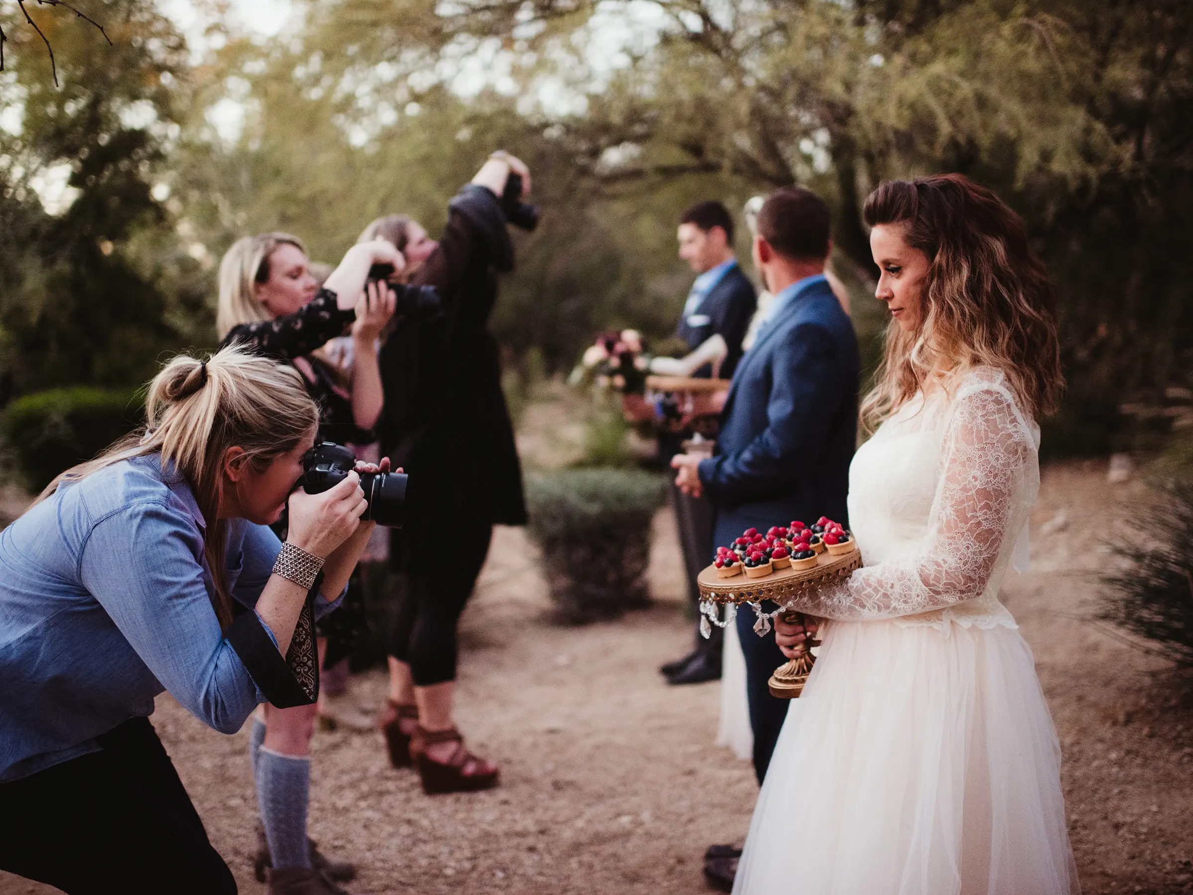 Photographers capturing a styled wedding shoot under the direction of Twig and Olive Photography at a workshop
