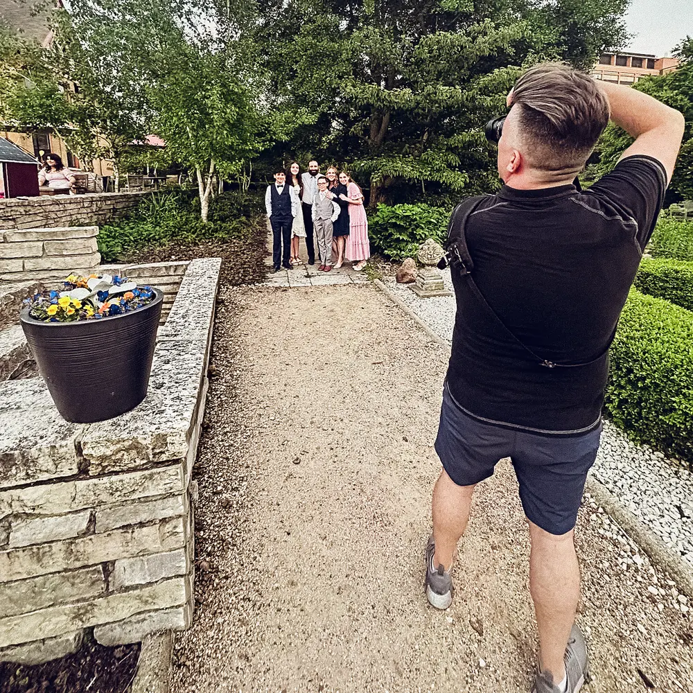 Doug photographing a group outdoors.
