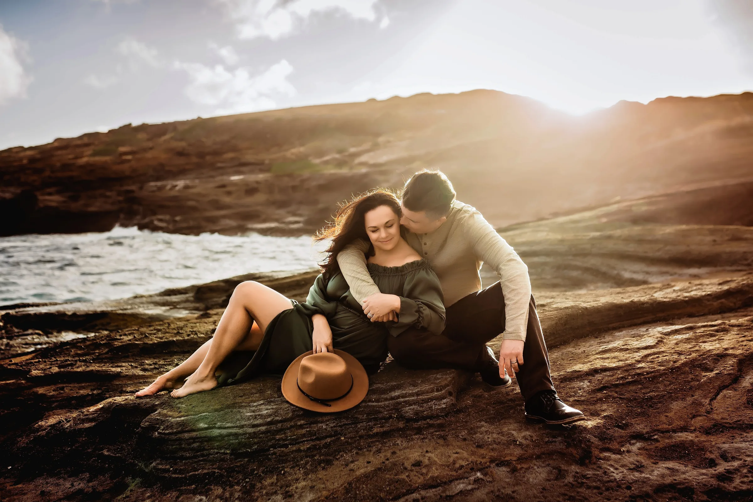 doug-courtney-by-the-water Doug and Courtney together on a rocky shoreline at sunset.