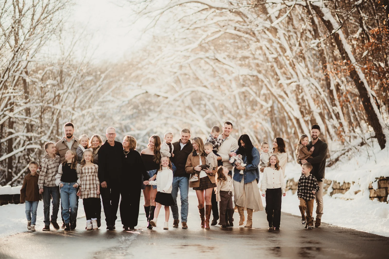 Extended family in winter An extended family standing together beneath snow-covered trees.